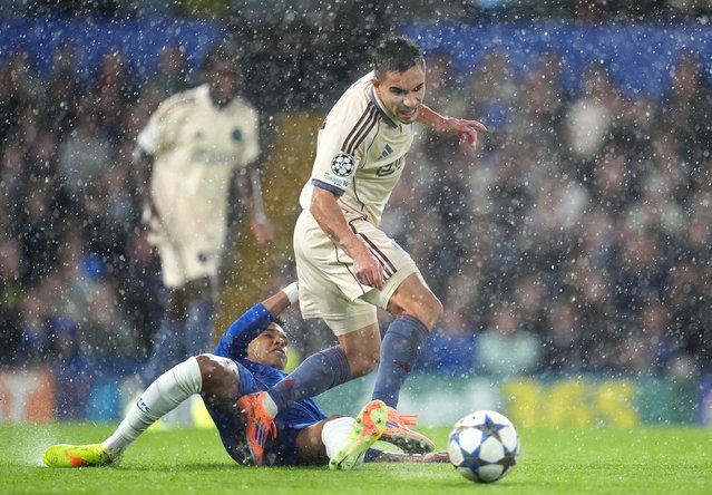 Ajax's Lucas Rosa (right) is challenged by Chelsea's Estevao during the UEFA Champions League match at Stamford Bridge, London on Wednesday, October 22, 2025. (Photo by Adam Davy/PA Images via Getty Images)