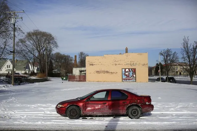 A Plymouth Breeze with rust spots sits parked in the snow in Detroit, Michigan January 10, 2015. (Photo by Joshua Lott/Reuters)