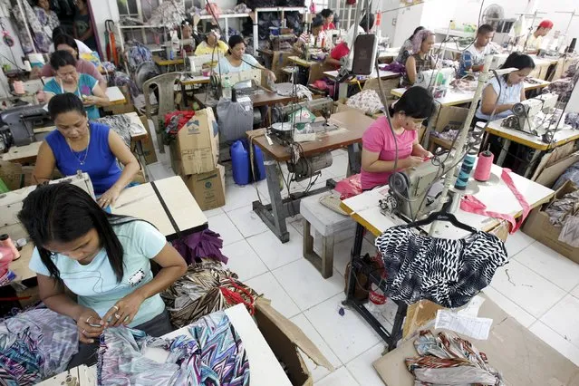 Garment workers sew maternity dresses at a factory of Additional Pelf Joys Trading Corp. at Taytay city, Rizal province, east of Manila in this May 1, 2013 file photo. The Philippines is expected to release inflation data this week. (Photo by Romeo Ranoco/Reuters)