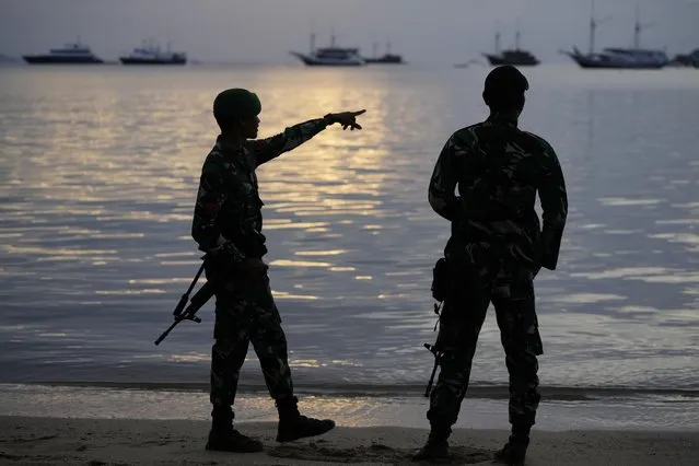 Indonesian soldiers stand guard at Labuan Bajo bay ahead of the 42nd China Trade meetings in Labuan Bajo, East Nusa Tenggara province, Indonesia, Tuesday, May 9, 2023. (Photo by Achmad Ibrahim/AP Photo)