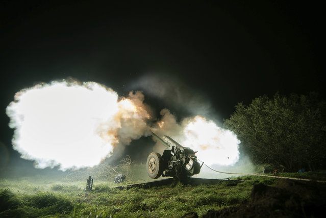Ukrainian servicemen fire from a 122mm artillery cannon towards Russian positions in Kherson region, Ukraine, Sunday October 27, 2024. (Photo by Marko Ivkov/AP Photo)