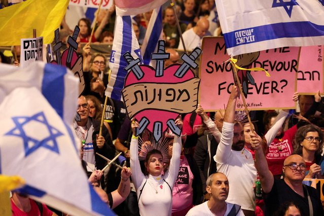 A woman holds up a sign reading “Evacuated” during a protest against Israeli Prime Minister Benjamin Netanyahu and his government and call for the immediate release of Gaza hostages, in front of the Knesset, Israel's parliament, during its winter opening session, in Jerusalem on October 28, 2024. (Photo by Violeta Santos Moura/Reuters)