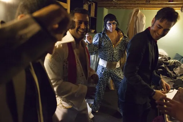 Participants joke around and dance backstage during the 20th annual Seattle Invitationals, an amateur Elvis impersonator competition, in Seattle, Washington January 23, 2015. (Photo by David Ryder/Reuters)