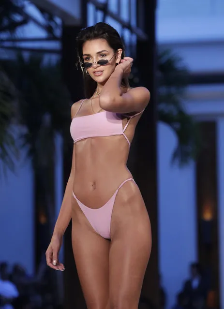 A model walks down the runway during the Fashion Palette Miami Australian Swim Show during Miami Swim Week, Sunday, July 15, 2018, in Miami Beach, Fla. (Photo by Lynne Sladky/AP Photo)