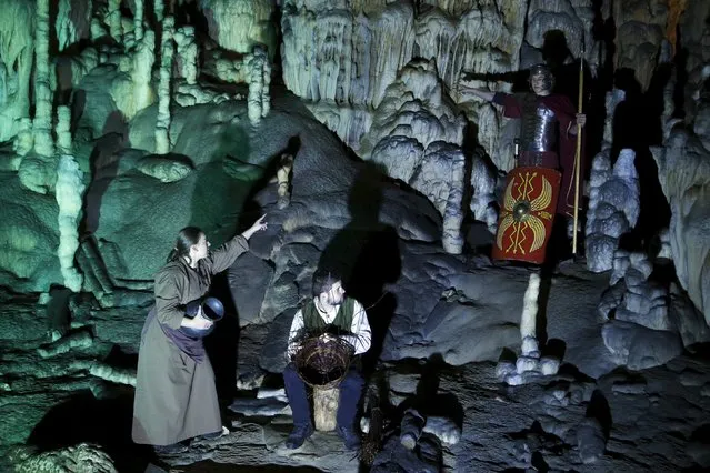 Actors perform the living Nativity biblical scenes in Postojna cave in Postojna, Slovenia, December 22, 2015. (Photo by Srdjan Zivulovic/Reuters)