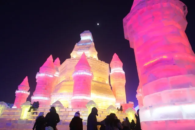 Tourists visit the 17th Harbin Ice And Snow World during its test run on December 22, 2015 in Harbin, China. The event will run from December 25, 2015 to February 25, 2016. (Photo by ChinaFotoPress/ChinaFotoPress via Getty Images)