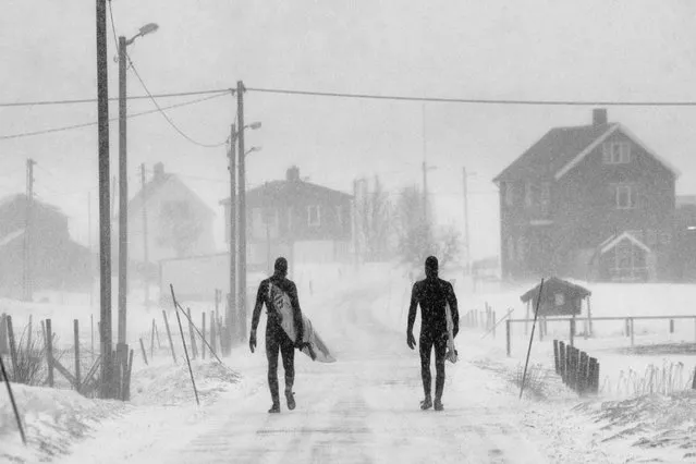 A shot of two surfers making their way home in the snow was captured by photographer Chris Burkhard to take first place in the “Spirit” category. (Photo by Chris Burkhard/Red Bull)