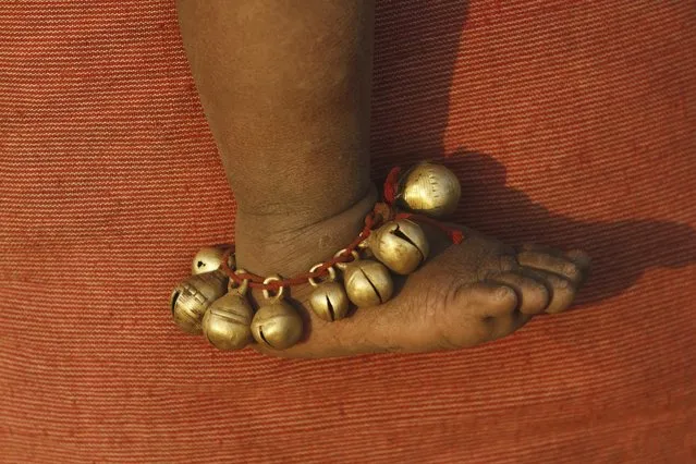 In this Saturday, February 21, 2015 photo, anklets of a child belonging to India’s Dongria tribe is seen during the two-day long Niyamraja Festival atop the Niyamgiri hills near Lanjigarh in Kalahandi district, Orissa state, India. (Photo by Biswaranjan Rout/AP Photo)