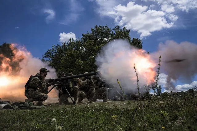 Ukrainian servicemen shoot with SPG-9 recoilless gun during training in Kharkiv region, Ukraine, Tuesday, July 19, 2022. (Photo by Evgeniy Maloletka/AP Photo)