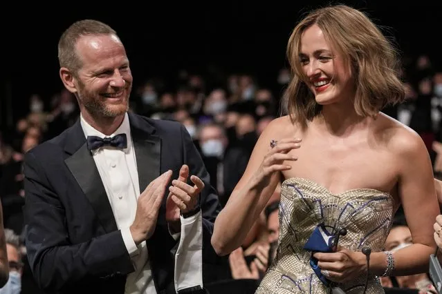 Joachim Trier, left, and Renate Reinsve, winner of the award for best actress for the film “The Worst Person in The World” appear in the audience during the awards ceremony at the 74th international film festival, Cannes, southern France, Saturday, July 17, 2021. (Photo by Vadim Ghirda/AP Photo)