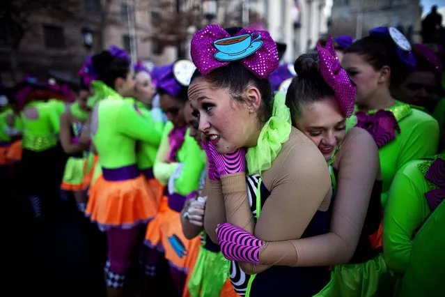 Performers react to the cold weather as they participate in the Macy's Thanksgiving Day Parade. (Photo by Kena Betancur/Getty Images)