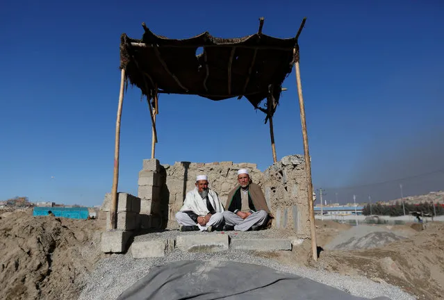 Afghan men sit in the sun during winter on a cold day in Kabul, Afghanistan January 8, 2017. (Photo by Mohammad Ismail/Reuters)