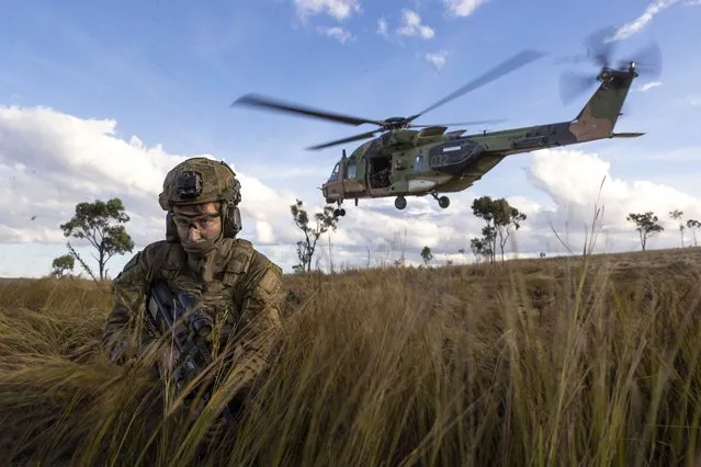 In this photo provided by the Australian Defense Force, soldiers from the 4th Regiment, Royal Australian Artillery and 3rd Battalion dismount from an MRH-90 Taipan during Exercise Chau Pha at Townsville Field Training Area, Townsville, Queensland, on June 12, 2023. The Australian army will never again fly its fleet of MRH-90 Taipan helicopters following a crash in July that killed four personnel, the defense minister said on Friday, Sept. 29, 2023. (Photo by LCPL Riley Blennerhassett/ADF via AP Photo)