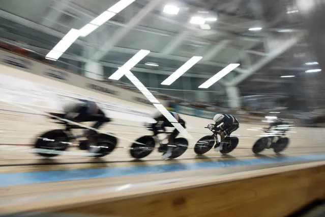 French riders compete during the men's team pursuit qualifying race at the UCI Track Cycling World Championship in Roubaix, north of France, Thursday, October 21, 2021. (Photo by Thibault Camus/AP Photo)