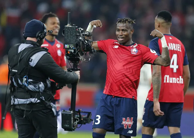 Lille's Youssouf Kone celebrates at the end of the French League One soccer match between OSC Lille and Paris-Saint-Germain at Stade Pierre Mauroy in Lille, France, Sunday, April 14, 2019. Lille won 5-1. (Photo by Michel Spingler/AP Photo)