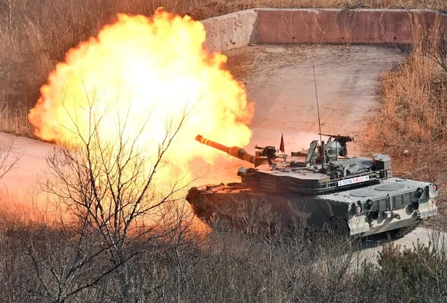 A South Korean K1A2 tank fires during a joint live fire exercise at a military training field in Pocheon on March 14, 2024 as part of the annual Freedom Shield joint military exercise between South Korea and the United States. (Photo by Jung Yeon-Je/Pool via Reuters)