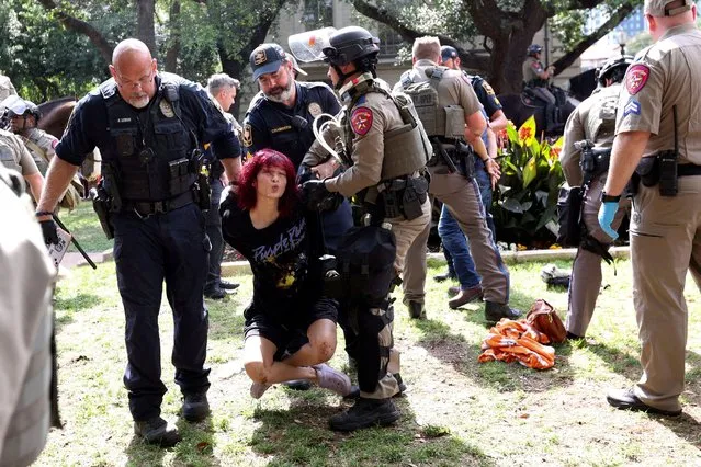 Law enforcement carry a pro-Palestinian protester at the University of Texas, during the ongoing conflict between Israel and the Palestinian Islamist group Hamas, in Austin, Texas on April 24, 2024. (Photo by Nuri Vallbona/Reuters)