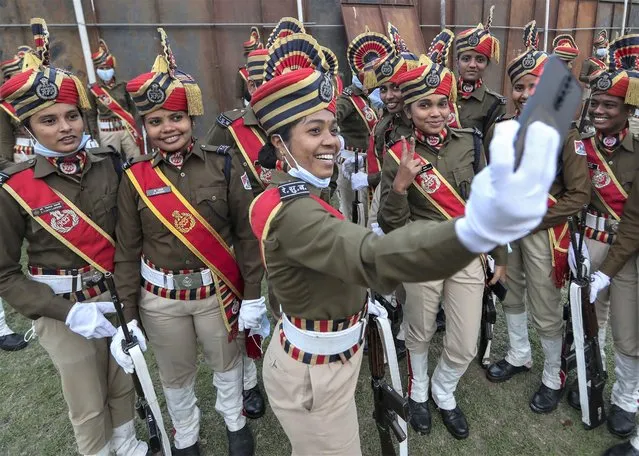 Indian Railway Protection Force personnel take selfie before marching during Republic Day celebrations in Hyderabad, India, Wednesday, January 26, 2022. (Photo by Mahesh Kumar A./AP Photo)