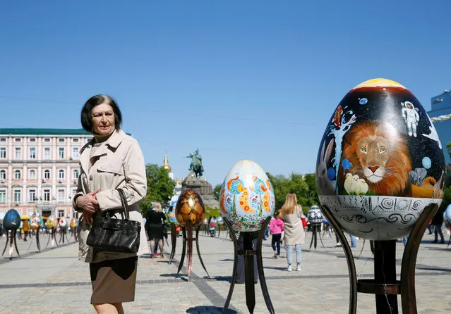 A woman looks at a traditional Ukrainian Easter egg “Pysanka”, installed as part of the upcoming celebrations of Easter, in central Kiev, Ukraine, April 29, 2016. (Photo by Valentyn Ogirenko/Reuters)