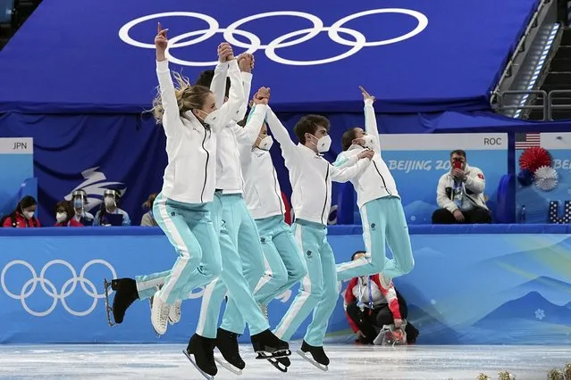 Gold medalists team from the Russian Olympic Committee celebrates following the victory ceremony after the team event in the figure skating competition at the 2022 Winter Olympics, Monday, February 7, 2022, in Beijing. (Photo by David J. Phillip/AP Photo)