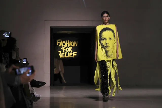 A model, wearing an outfit which has on it the image of model Kate Moss, walks the runway at the Fashion For Relief charity event in central London, Saturday, September 14, 2019. (Photo by Vianney Le Caer/Invision/AP Photo)