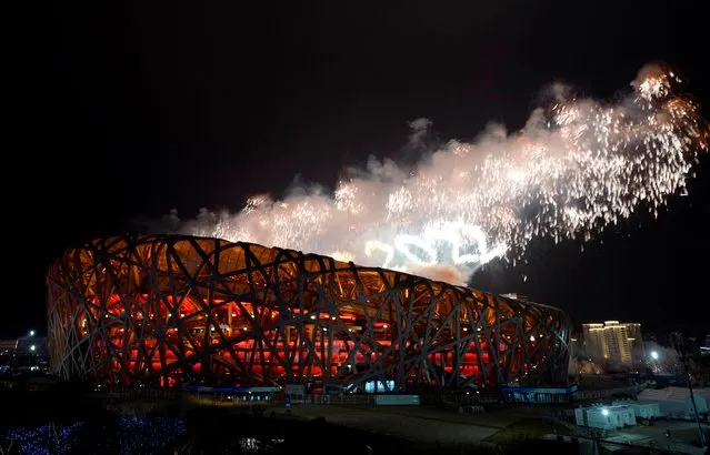General view as fireworks are seen over the National Stadium during the Beijing 2022 Winter Paralympic Games closing ceremony at the National Stadium, Beijing, China, March 13, 2022. (Photo by Aly Song/Reuters)