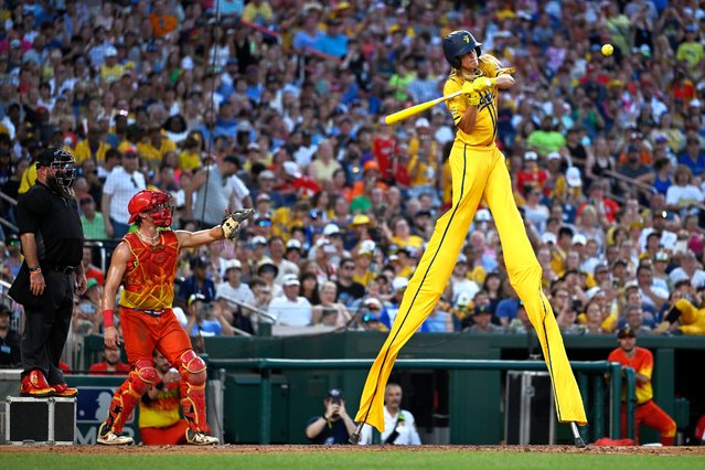 Dakota “Stilts” Albritton of the Savannah Bananas makes contact with the ball during a baseball game against the Firefighters at Nationals Park in Washington on July 13, 2024. (Photo by John McDonnell for The Washington Post)