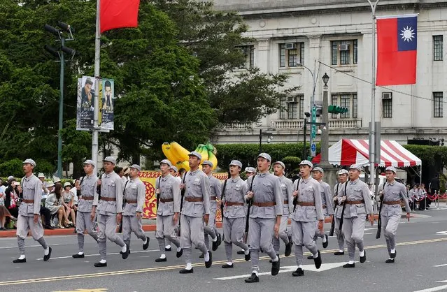 Performers dressed as former Kuomintang army solders march during a parade to reflect Taiwan's history as part of an inauguration ceremony of Taiwan’s President Tsai Ing-wen in Taipei, Taiwan May 20, 2016. (Photo by Tyrone Siu/Reuters)