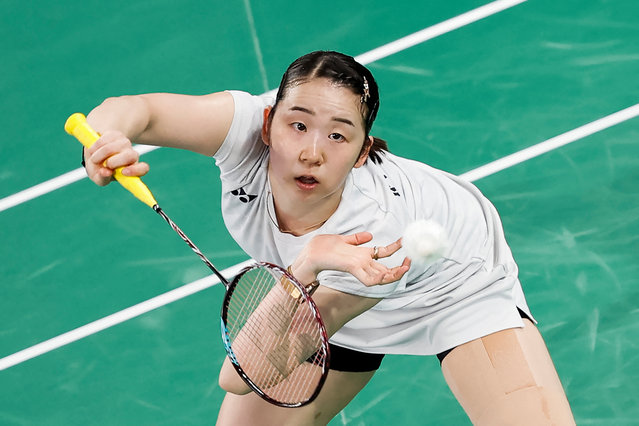 Japan's Wakana Nagahara plays a shot in the women's doubles badminton group stage match against China during the Paris 2024 Olympic Games at Porte de la Chapelle Arena in Paris on July 30, 2024. (Photo by Luis Tato/AFP Photo)