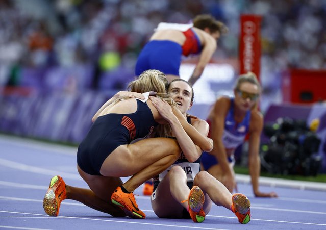 Laura Muir and Georgia Bell of Team Great Britain are seen after the Women's 1500m final on day fifteen of the Olympic Games Paris 2024 at Stade de France on August 10, 2024 in Paris, France. (Photo by Sarah Meyssonnier/Reuters)