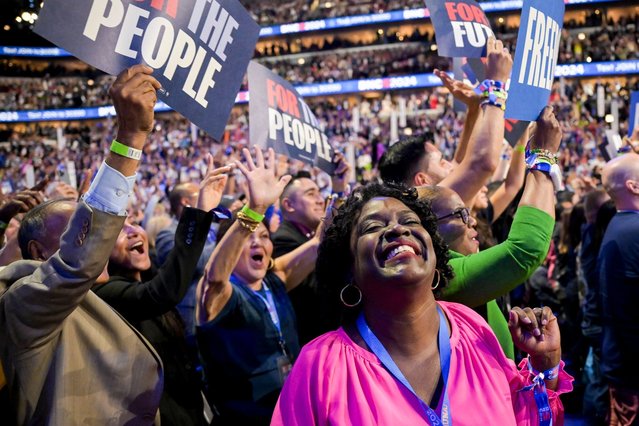 A delegate cheers during the Democratic National Convention (DNC) at the United Center in Chicago, Illinois, US, on Tuesday, August 20, 2024. The Democratic National Convention this week marks the ceremonial crowning of Vice President Kamala Harris and Minnesota Governor Tim Walz as the party's presidential nominees, capping off a whirlwind month for Democrats who quickly coalesced behind the new ticket after President Joe Biden dropped out of the race in July. Photographer: (Photo by Victor J. Blue/Bloomberg)