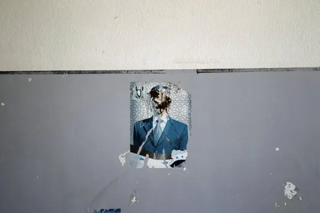 A defaced image of Syria's President Bashar al-Assad is pictured on a wall inside “Syria, The Hope” school on the outskirts of the rebel-controlled area of Maaret al-Numan town, in Idlib province, Syria June 1, 2016. (Photo by Khalil Ashawi/Reuters)