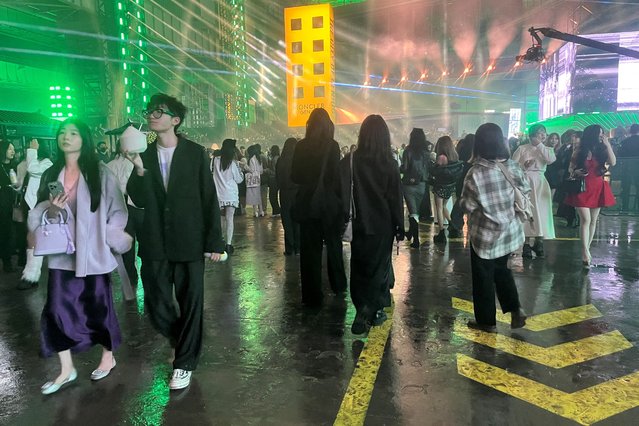 Guests view the Moncler Genius “The City of Genius” show in Shanghai, China on October 19, 2024. (Photo by Casey Hall/Reuters)