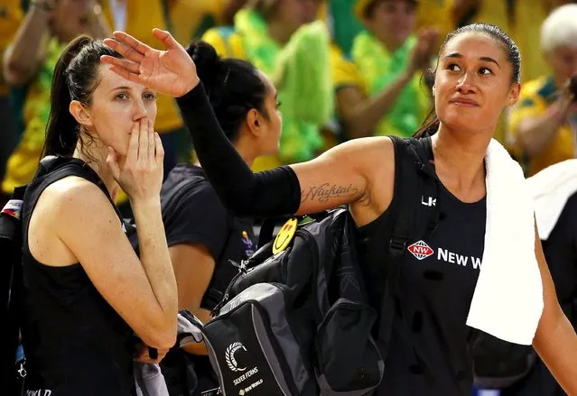 Maria Tutaia (R) of New Zealand and team mate Bailey Mes react as they leave the court after losing their Netball World Cup final game against Australia in Sydney, August 16, 2015. (Photo by David Gray/Reuters)