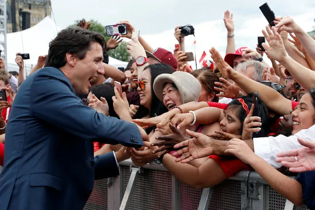 Canada's Prime Minister Justin Trudeau shakes hands with spectators during Canada Day celebrations on Parliament Hill in Ottawa, Ontario, Canada, July 1, 2016. (Photo by Chris Wattie/Reuters)