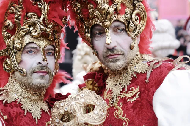 Masked attendees at the annual carnival in Venice, Italy on February 16, 2020. (Photo by Mirco Toniolo/AGF/Rex Features/Shutterstock)
