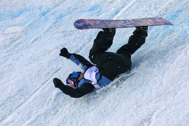 Hiroto Ogiwara of Japan falls as he competes in the men's Snowboard Big Air qualifying round during the FIS Snowboard & Freeski World Cup 2024 at the Shougang Park in Beijing, Saturday, November 30, 2024. (Photo by Andy Wong/AP Photo)