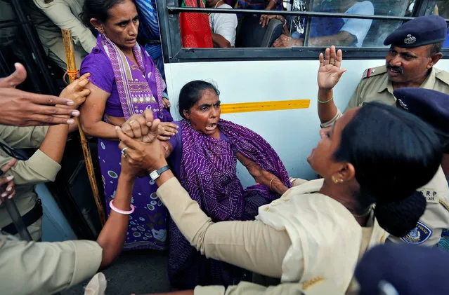 A woman reacts as she is detained by police during a protest against the flogging of four members of India's low-caste Dalit community accused of skinning a cow in Ahmedabad, India, July 25, 2016. (Photo by Amit Dave/Reuters)