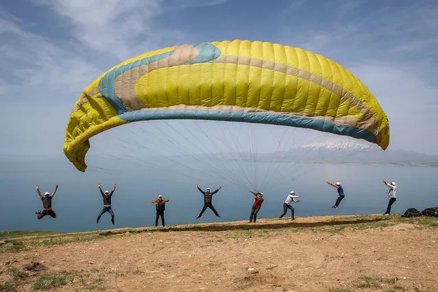 A group of paragliders arrive to perform demonstration flights with a special permission from Governorate of Van on 19th May Commemoration of Ataturk, Youth and Sports Day near Ayanis Castle at Tusba district in Van, Turkey on May 19, 2020. They also gave a message to people of Van – “Stay at Home”, due to the novel coronavirus (COVID-19) pandemic during their flights. May 19 is a milestone in Turkish history, the day when Mustafa Kemal arrived in the Black Sea city of Samsun from Istanbul in 1919 to launch the war that transformed the nation into modern Turkey four years later. Ataturk dedicated May 19 to the youth of Turkish nation as Youth and Sports Day – a national holiday that sees young people stage sporting and cultural activities and official ceremonies organized across the nation. (Photo by Ozkan Bilgin/Anadolu Agency via Getty Images)