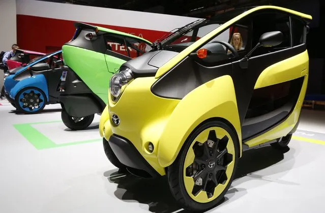 Three wheel design and ultra compact Toyota I-Road electric cars are displayed on media day at the Paris Mondial de l'Automobile, October 2, 2014. (Photo by Jacky Naegelen/Reuters)