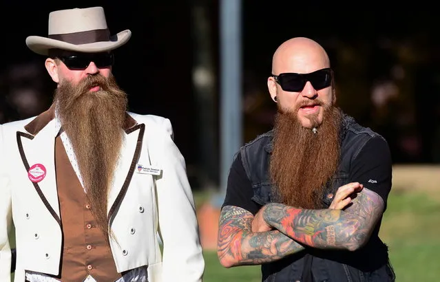 Patrick Dawson (L) from Tacoma, Washington, stands beside a friend while watching the competition at the third annual National Beard and Moustache Championships in Las Vegas, Nevada on November 11, 2012. (Photo by Frederic J. Brown/AFP Photo)