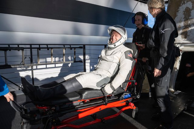NASA astronaut Butch Wilmore is helped out of a SpaceX capsule onboard the SpaceX recovery ship Megan after landing in the water off the coast of Tallahassee, Fla., Tuesday, March 18, 2025. (Photo by Keegan Barber/NASA via AP Photo)