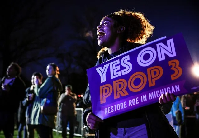 Michigan Jaelynn Smith, a freshman at Michigan State University, holds a sign in support of Proposal 3, a ballot measure which would codify abortion rights, during a 'get out the vote' rally at MSU, the night before the midterm election, in East Lansing, Michigan, U.S., November 7, 2022. (Photo by Evelyn Hockstein/Reuters)