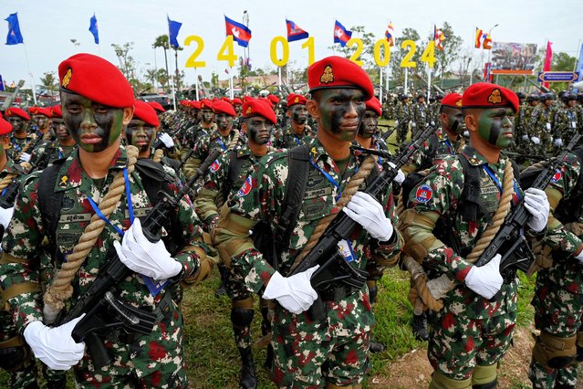A commando unit stand in formation during a ceremony marking the 25th anniversary of the formation of the Royal Cambodian Army in Phnom Penh on January 24, 2024. (Photo by Tang Chhin Sothy/AFP Photo)