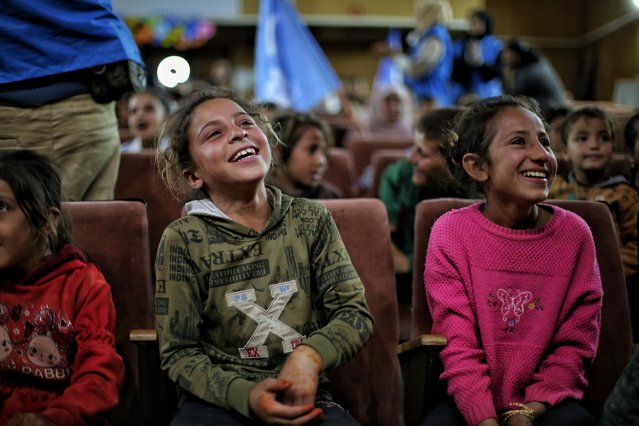 Smile United Association held an entertainment event for children in displacement camps, at the cultural center in the western Aleppo countryside, Atarib, northwest Syria, 02 April 2025. The event featured a play and Eid toys were distributed to the children. (Photo by Bilal Hammoud/EPA)