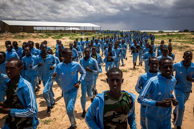 Somali National Army trainee soldiers take part in military drills in Hiilweyne training institute in a military base north of Mogadishu on April 21, 2025 in Mogadishu, Somalia. Two thousand men are being trained at the base, which came under attack for the first time last week when militant group Al-Shabaab fired a mortar round into the grounds, killing one trainee and injuring two others, accounting to commanders at the base. There are concerns of a jihadist resurgence in Somalia amid growing attacks by Al-Shabaab, which has been fighting the government for nearly two decades and controls swathes of the southern and central parts of the country. Last week, Al-Shabaab fighters raided the strategically important town of Adan Yabaal, north of Mogadishu, prompting a U.S.-backed airstrike on the militants. Besides the United States, Somali also has support from other international partners, including the African Union's new Stabilization and Support mission in Somalia, known as AUSSOM. But there is uncertainty about the future of AUSSOM's mandate after the U.S. recently objected to a United Nations proposal for funding the mission. (Photo by Ed Ram/Getty Images)