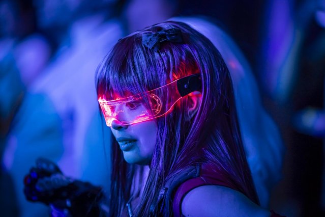 A guest poses for a picture during the Token2049 conference in Dubai on April 30, 2025. (Photo by Antonie Robertson/The National)