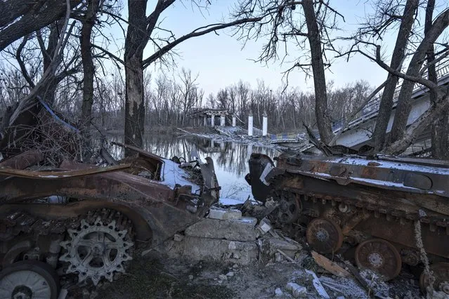 A destroyed bridge across Siverskyi-Donets river in the recently retaken village of Bogorodychne, Ukraine, Saturday, January 7, 2023. (Photo by Evgeniy Maloletka/AP Photo)