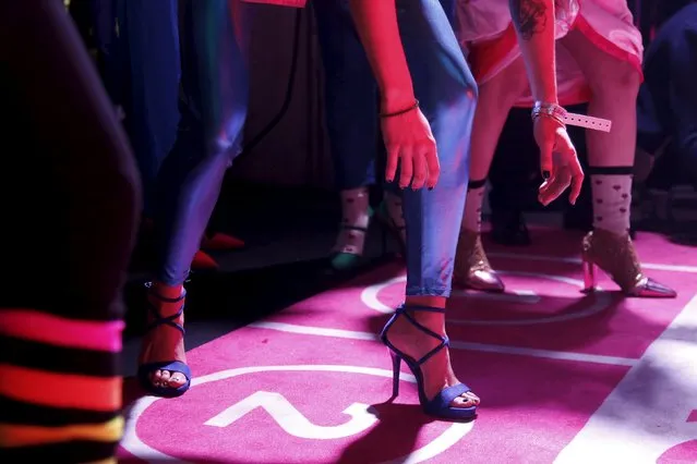 Contestants prepare to start in a high heels race in Paris, France, October 15, 2015. (Photo by Charles Platiau/Reuters)