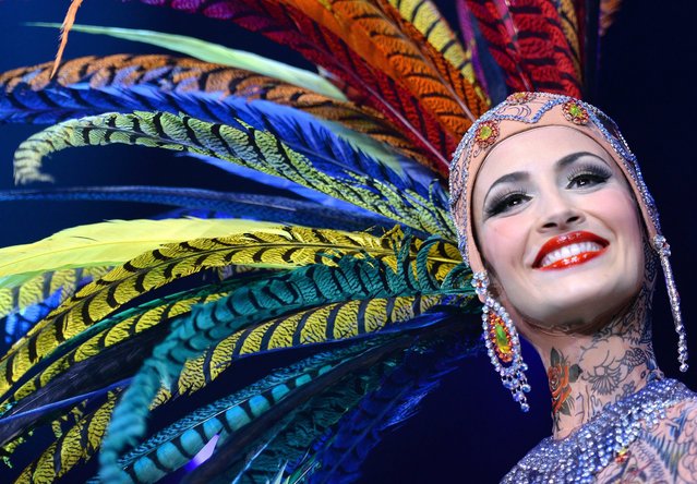 A dancer smiles on stage during a photocall for the revue show “The One – Grand Show” at the Friedrichstadt Palast in Berlin, Germany, 28 September 2016. The show, which features costumes by French fashion designer Jean Paul Gaultier, premieres on 06 October. (Photo by Britta Pedersen/EPA)